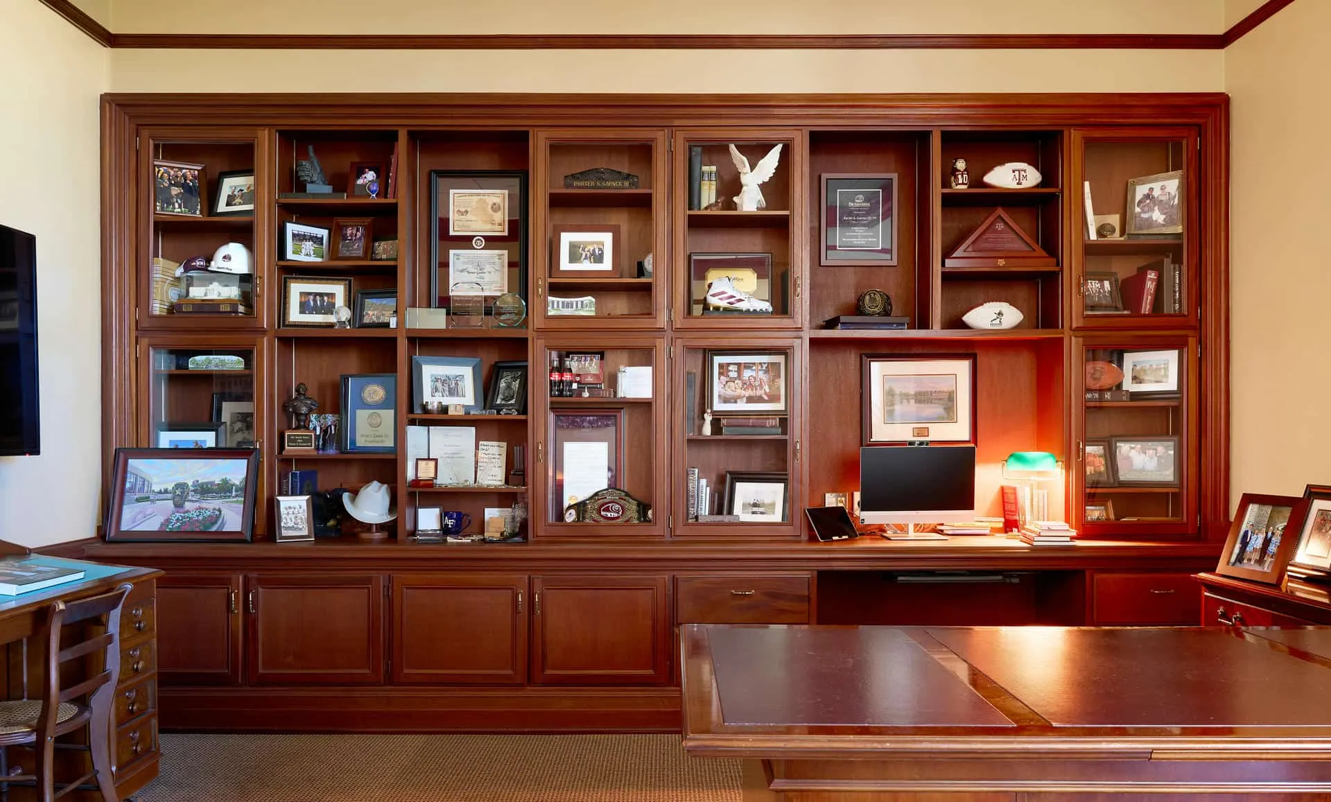 The bookcase behind Porter Garner’s desk, filled with framed photos and mementos