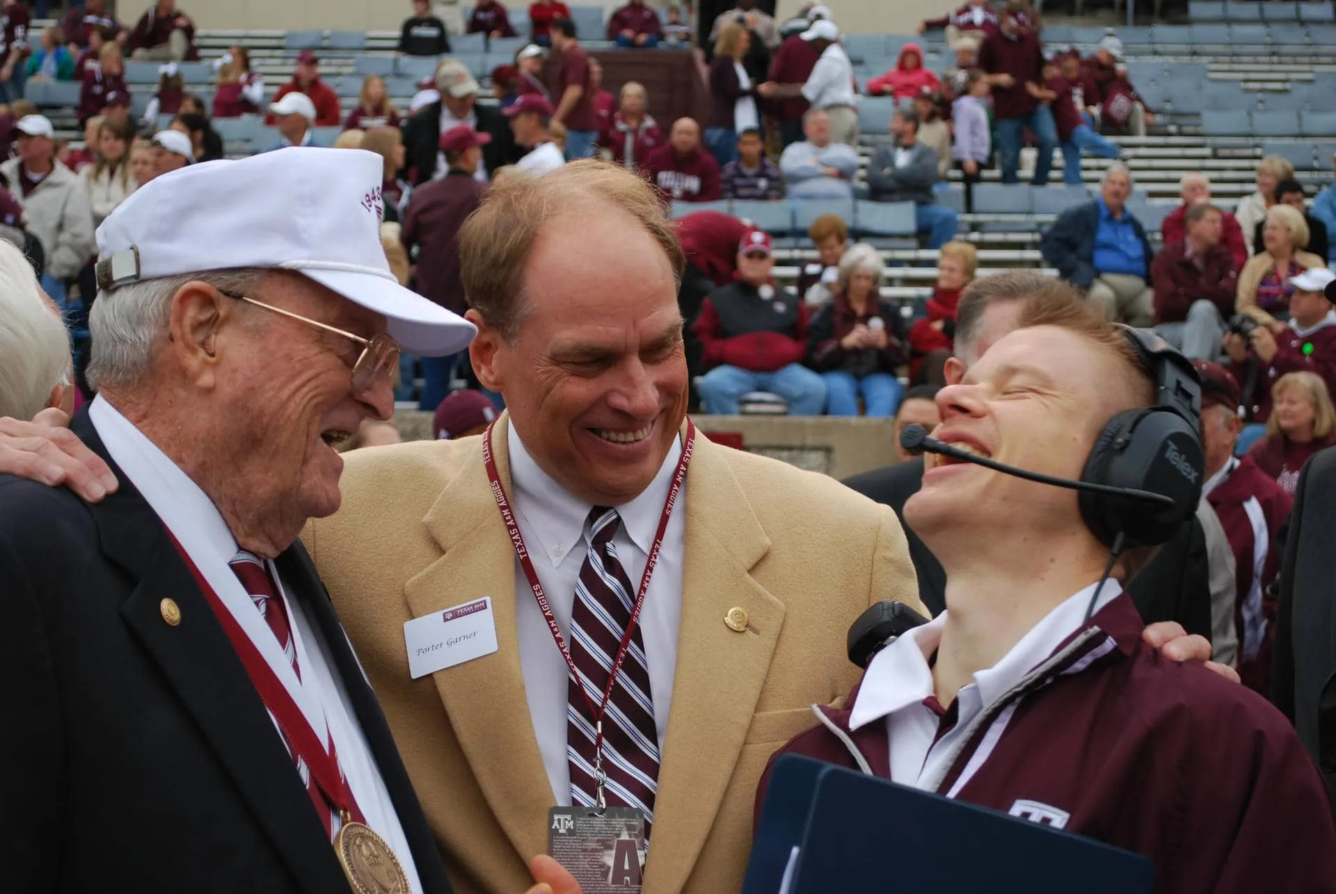 Garner talking with Distinguished Alumnus Frank Litterst and Rob Stewart at Kyle Field on gameday