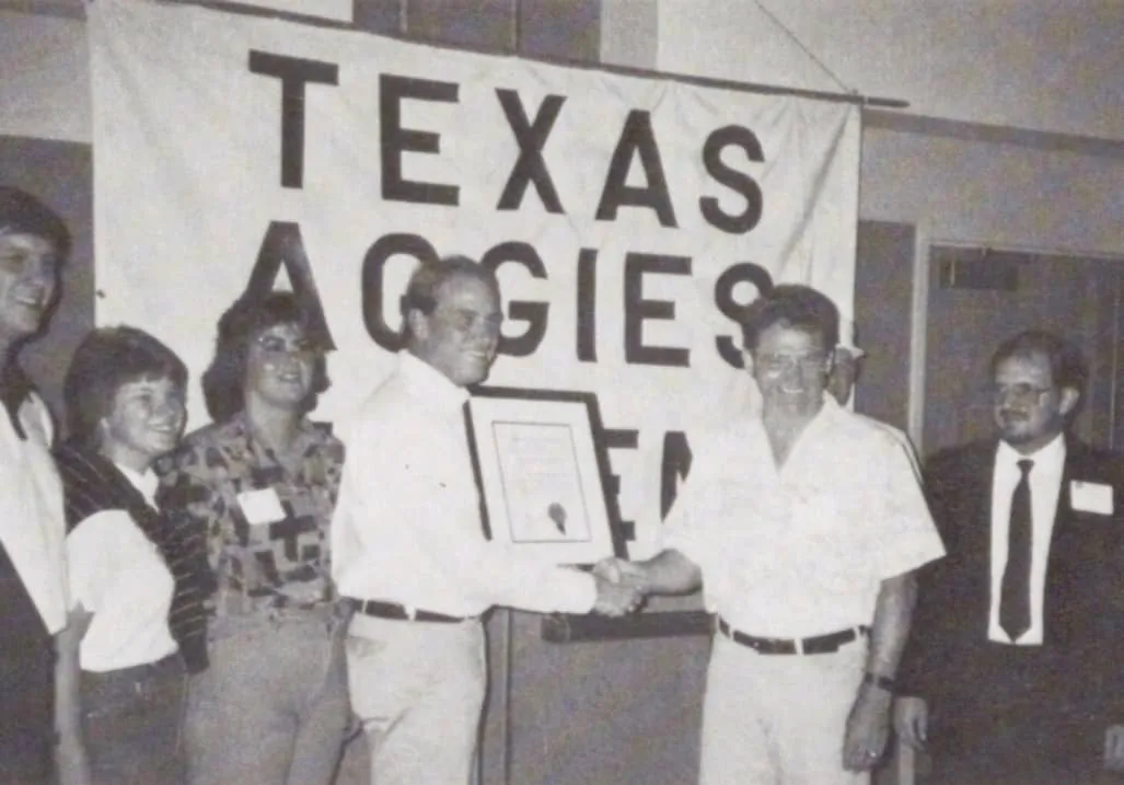 Garner presenting the Columbia Basin A&M Club charter to Bill Dickey in Seattle