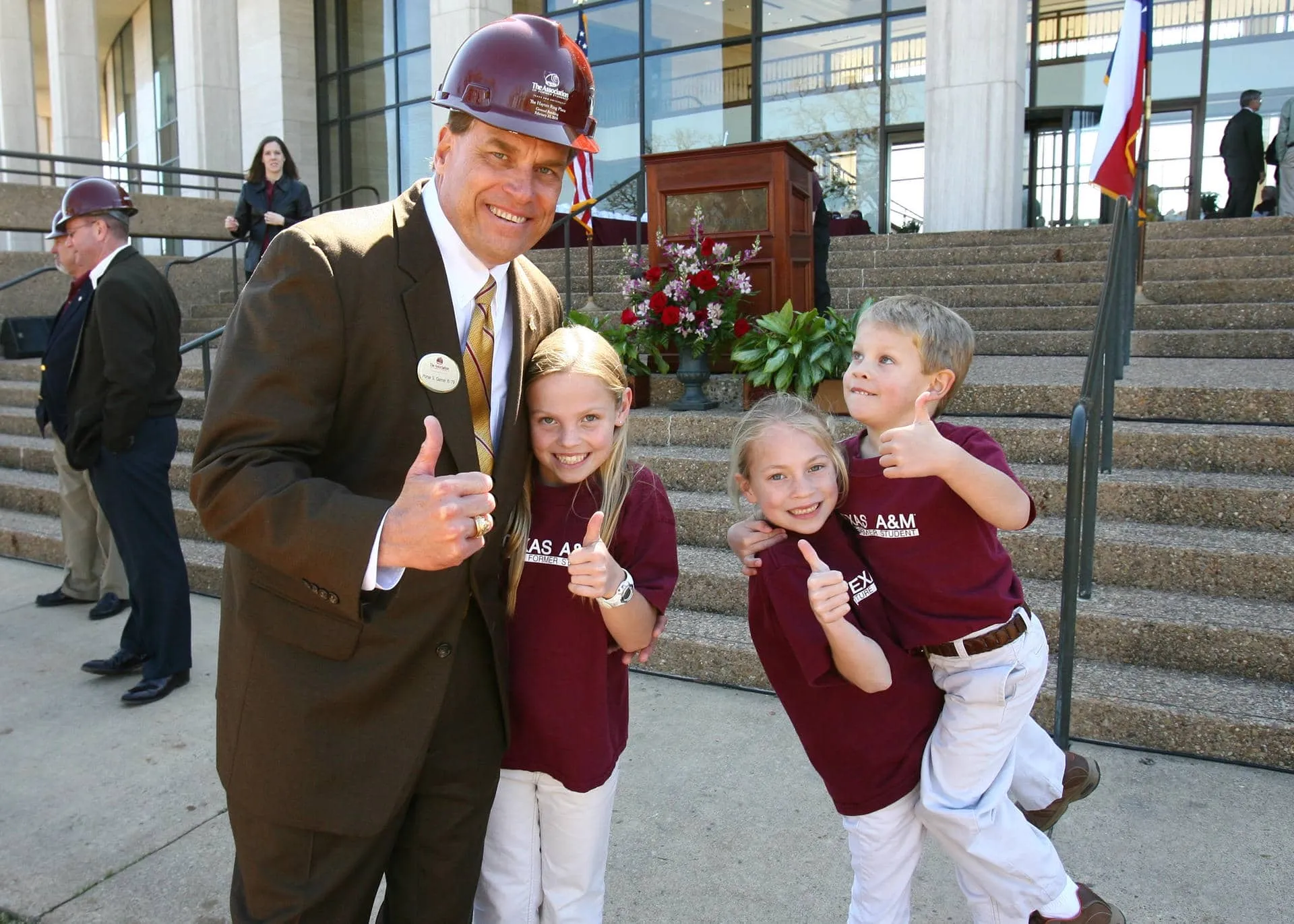 Garner’s three children turning shovels of dirt at the Haynes Ring Plaza groundbreaking
