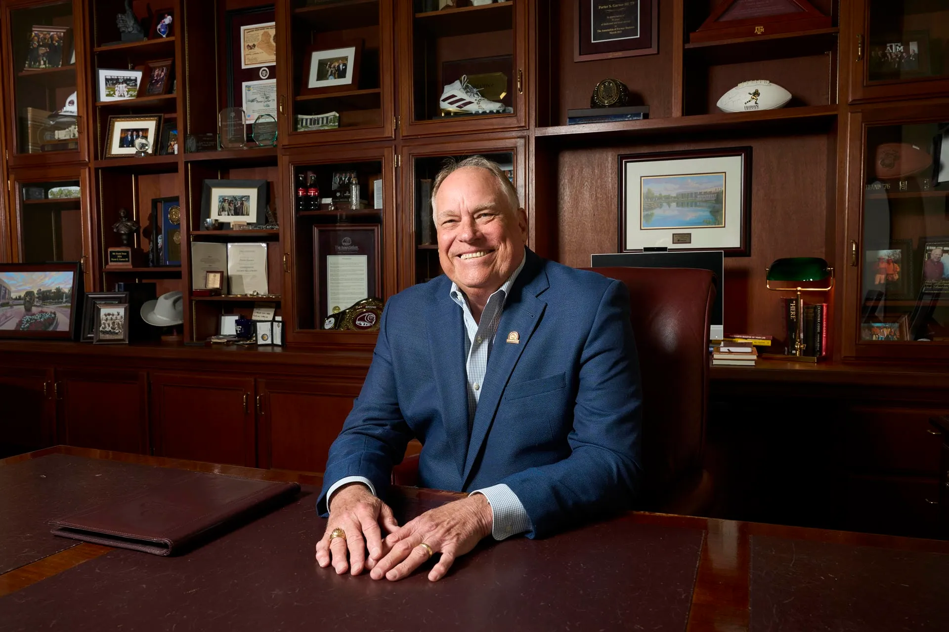 Porter Garner at his desk in front of the bookcase in his Association office